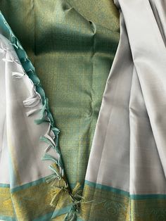 Beautiful Pure Kanchipuram Silk Saree in Silver Gray with Turquoise Blue Pure Zari Border and Blouse Piece- A unique piece of drape and unique color combination Traditional Blue Tissue Silk Unstitched Suit, Festive Turquoise Silk Set, Turquoise Saree For Wedding And Eid, Elegant Turquoise Dupatta For Diwali, Elegant Turquoise Traditional Wear For Festivals, Turquoise Silk Saree With Pallu Detail, Turquoise Silk Saree With Traditional Drape, Turquoise Silk Traditional Wear With Dupatta, Turquoise Silk Saree For Diwali