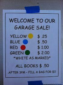 a garage sale sign is posted on the wall