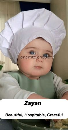 a baby wearing a chef's hat while sitting in front of a bowl with food