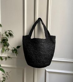 - Piece made by hand in our Malagasy workshop - Woven by: Ranja - Shoulder basket - Raffia exterior in two different weaves - Raffia interior with one pocket - Handle length: 22 cm - Non-adjustable handle - Bag weight: 300 g - Dimensions: 39cm * 29cm * 17cm - Color: dark tea or black ▫️ NATURAL MATERIAL ▫️ HANDMADE ▫️ ECO-FRIENDLY Straw Bucket Bag With Intrecciato Weave, Natural Bucket Bag With Intrecciato Weave, Everyday Straw Bags With Intrecciato Weave, Straw Bucket Shoulder Bag With Intrecciato Weave, Natural Intrecciato Tote Bag, Natural Color Intrecciato Weave Tote Bag, Rectangular Intrecciato Weave Bucket Bag For Vacation, Natural Woven Leather Crochet Bucket Bag, Intrecciato Weave Crochet Shoulder Bag For Vacation