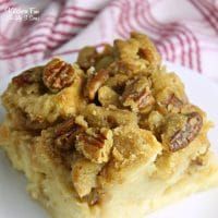 a close up of a plate of food with pecans on it and a towel in the background