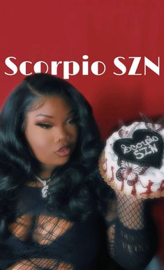 a woman holding a cake in front of her face with the caption scorpio szn