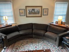 a large sectional couch sitting on top of a rug