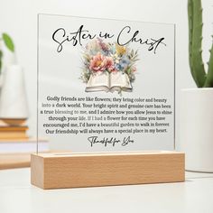 a clear acrylic plaque with the words sister in christ and flowers on it