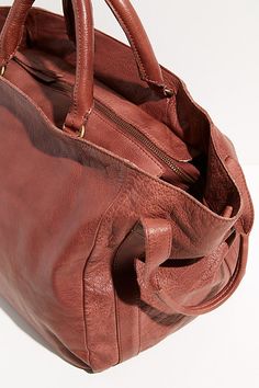 Oversized leather satchel featured in a distressed pebbled style with top and side handles and a detachable shoulder strap.* Zipper top closure* Lined interior* Inner zip and slip pockets Zipper Top, Artisan Craft, Vintage Aesthetic, Boho Clothing, Leather Satchel, Boho Outfits, Leather Tote, Bucket Bag, Color Coding