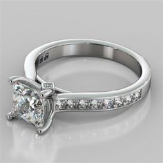 a princess cut diamond engagement ring with channel set diamonds