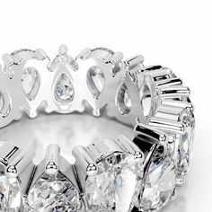 a diamond ring is shown with three rows of diamonds on the side and four rows of round