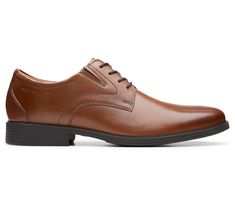 Step into sophistication with the Whiddon Plain dress shoe, featuring a seamless blend of rich materials and exceptional comfort designed for the modern man's lifestyle. From workdays to weekends, these shoes are your reliable companion, offering a heritage look with their crafted leather uppers while ensuring every step is a pleasure. From Clarks. Business Wingtip Dress Shoes With Ortholite Insole, Synthetic Leather Wingtip Shoes For Business, Elegant Synthetic Oxfords For Business, Business Plain Toe Synthetic Oxfords, Oxford Dress Shoes With Removable Insole For Business, Business Oxfords With Cushioned Footbed In Synthetic, Formal Synthetic Leather Shoes With Cushioned Footbed, Business Synthetic Oxfords With Cushioned Footbed, Synthetic Leather Shoes With Cushioned Footbed For Formal Events