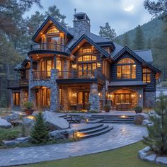 a large house with lots of windows and stone steps