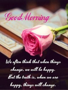 a pink rose sitting on top of an open book with the words good morning above it