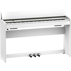 a white piano sitting on top of a table