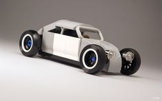 a toy car is shown on a white surface with black rims and wheels, as if it were built from lego