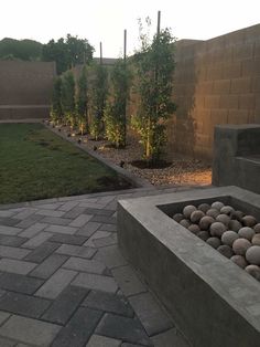 an outdoor fire pit with rocks in the middle