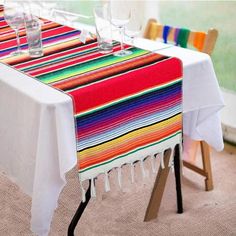 the table is set with colorful place mats