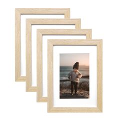 three wooden frames with an image of a child standing on the beach