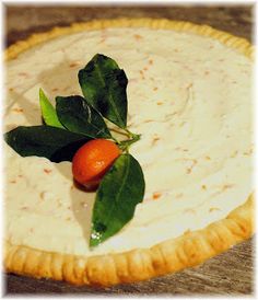 an orange and spinach garnish on top of a pie