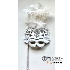 Diner en blanc Mask, White Party, Prom, Wedding Mask, Masquerade Ball, Mardi Gras, Masked Ball- Save Venice, Feather mask-  NYC Masked ball, Mardi Gras, All white party  Welcome!   Handmade, one of a kind mask.  Each rhinestone was meticulously hand placed one by one onto the mask. This mask is made is made from papermache, hand-painted and adorned feathers, stones and a filigree center detail. Perfect mask for a masquerade party, birthday celebration, New Years celebration, Wedding mask, Diner Mask With Feathers, Mask Masquerade Ball, Rhinestone Mask, New Years Celebration, Mask White, Feather Mask, Masked Ball, All White Party, Mask Masquerade