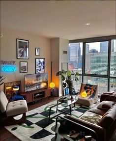 a living room filled with furniture and large windows