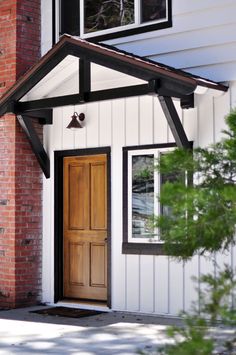 a white house with a wooden door and window