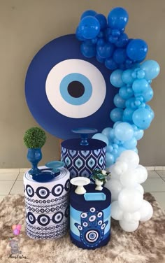 an eyeball balloon decoration with blue and white balloons