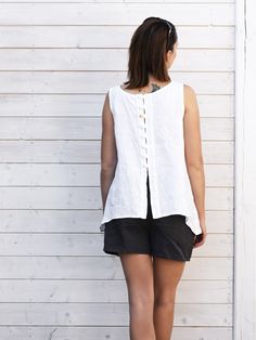 "Linen top. Its airy, soft and light, thanks to being linen. Perfect for hot days. Surprising at the back, with buttons. It is universal, idyllic and simple. Its made by Polem Po Len studio for you. Authentically handmade. Just convenient and relaxed. Pair with shorts, jeans, trousers and even underneath a cardigan DETAILS: - 100% linen, washed, softened, easy to clean  - Includes one top - Round neckline - Buttons and loops at the back - Longer on the sides - French seams - Shrinkage after the Sleeveless Linen Blouse For Vacation, Sleeveless Summer Tops With Button Back, Sleeveless Button Back Tops For Summer, Sleeveless Linen Blouse For The Beach, Sleeveless Linen Blouse For Beach, Sleeveless White Linen Blouse, White Sleeveless Linen Blouse, White Linen Top, Ladies Shirt