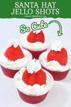 three small cups filled with whipped cream and strawberries in the shape of santa hats