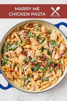 a pan filled with chicken pasta and spinach