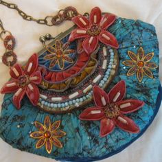 Mary Frances Textured, Embellished & Jeweled Cloth & "Velvet" Multi-Color (Blue/Teal/Mauve/Gold) Purse W/ Attached Flowers, Inset Beads And Gold Chain Strap; Measures 10" Wide (At Fullest Point) And Is 8" Top To Bottom. It Is New W/ Original Bag, But No Tags, Os Blue Bohemian Bag For Evening, Blue Bohemian Evening Bag, Blue Embellished Bag For Everyday Use, Bohemian Blue Bags As Fashion Accessory, Mary Frances Bags, Embellished Purses, Gold Purse, Mary Frances, Original Bags