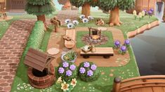 an animated garden with flowers, trees, and a fire pit in the middle of it