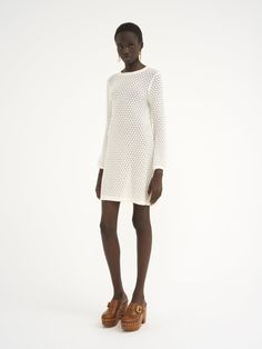 Chloé Mini Dress In Cotton Pointelle | Chloé US White Textured Knit Sweater Dress For Spring, Spring Textured Knit Sweater Dress, Spring Sweater Dress With Pointelle Knit, Spring Pointelle Knit Sweater Dress, Chic White Crochet Dress With Pointelle Knit, Spring Long Sleeve Pointelle Crochet Dress, Spring Long Sleeve Pointelle Knit Crochet Dress, Spring Long Sleeve Crochet Dress With Pointelle Knit, White Pointelle Knit Sweater Dress