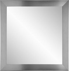 a silver framed mirror on a white wall with an empty space for the reflection to be seen