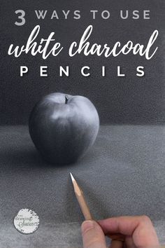 someone is painting an apple with white charcoal pencils