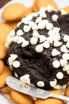 a chocolate cake with white sprinkles on it