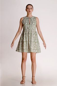 The Alicia shirt midi dress is a springtime staple. Crafted with care from cotton, its charming block print adds flair to its warm green shade. Featuring a collared design and front button closure, this jade short-sleeve maxi dress exudes casual elegance. With two handy pockets, it's as practical as it is stylish, making it perfect for effortless chic on sunny days.Material: Cambric - 100% cottonStyle/Print: Hand Block PrintNumber of Pockets: 2Length: 45 inchesOccasion: CasualColor: Jade Green A-line Cotton Midi Dress, Green Cotton Midi Dress For Daywear, Spring Daywear Dresses With Block Print, Spring Green Dresses With Block Print, Green Block Print Dresses For Spring, Spring Sleeveless Block Print Dress, Block Print Midi Dress For Spring, Casual Daywear Dress With Block Print, Casual Block Print Dress For Daywear