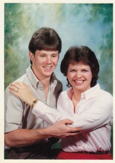 a man and woman are posing for a photo