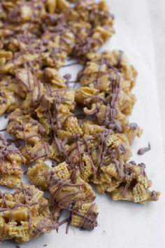 chocolate drizzled cookies on top of white paper