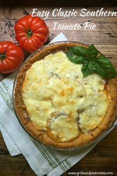 an easy classic southern tomato pie on a wooden table with tomatoes in the background and text overlay that says easy classic southern tomato pie