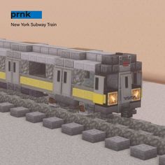 the new york subway train is coming down the tracks