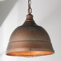 an old fashioned light hanging from a ceiling