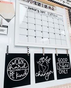 three black and white magnets hanging on a wall next to a ruler with the words work hard, be kind of change