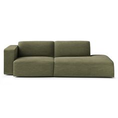 a green couch sitting on top of a white floor