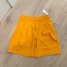 Yellow Trouser Shorts Yellow Summer Shorts For Work, Chic Yellow Shorts For Workwear, Yellow Shorts For Workwear In Spring, Yellow Shorts For Spring Workwear, Yellow Workwear Shorts For Spring, Yellow Short Bottoms For Work, Yellow Workwear Bottoms Shorts, Yellow Short Length Bottoms For Workwear, Yellow Short Length Workwear Bottoms