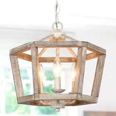 a wooden light fixture hanging from a ceiling