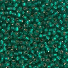 green seed beads with holes in the middle