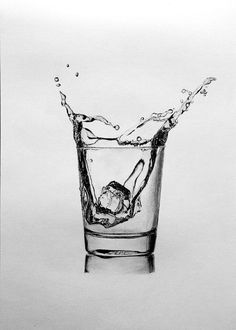 a black and white photo of a glass with water splashing on it