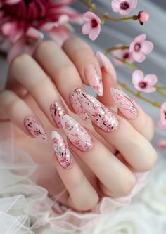 Revel in the bloom of spring with these oval nails, featuring a soft pink base and sprinkles of cherry blossom designs. A breath of fresh air for your nail style. Blossom with more ideas at nailhow.com. Cherry Blossom Manicure, Ombre Nails Flower, Dusty Pink Nails, Aries Women, Neon Pink Nails, Cherry Blossom Nails, China Nails, Blossom Wedding, No Chip Nails