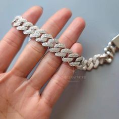 Product: 925 Sterling Silver Iced Out Moissanite Cuban Link Chain Bracelet Chain: 14mm Miami Cuban Link Chain Stone: 1.2mm Round D color, VVS1, Excellent Cut Moissanite Diamond with Hand Made Prong Pave Setting Length: The measurement of this bracelet is from end to end, please leave me a note for the length you want, I will ask my jewelry to fix it before I ship. Important Information: * An elegant gift box and a silver polish cloth are included, gift message can be added as optional. * All Ite Graduation Gifts For Sister, Cuban Link Bracelet, Round Moissanite Engagement Ring, Miami Cuban Link Chain, Engagement Ring Photos, Miami Cuban Link, Silver Polish, Rock Jewelry, Miami Cuban