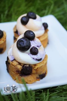 small desserts with blueberries and cream on a white plate