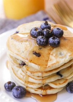 pancakes with blueberries and syrup on a plate