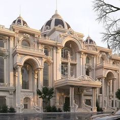 a large white building with many windows and balconies